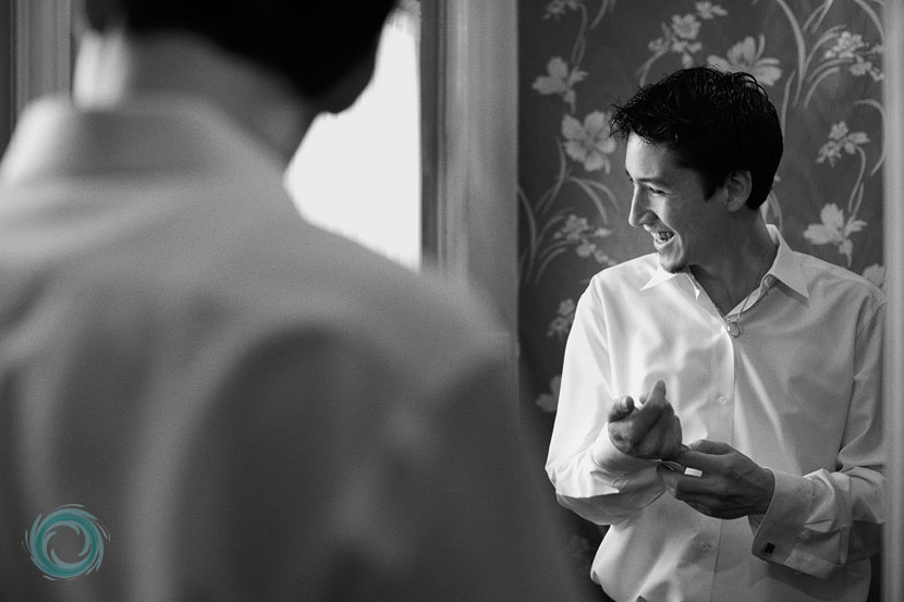 reflection-of-groom-getting-dressed