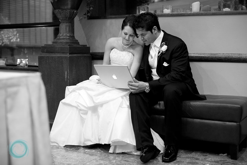 bride-and-groom-watching-their-same-day-wedding-slideshow-01