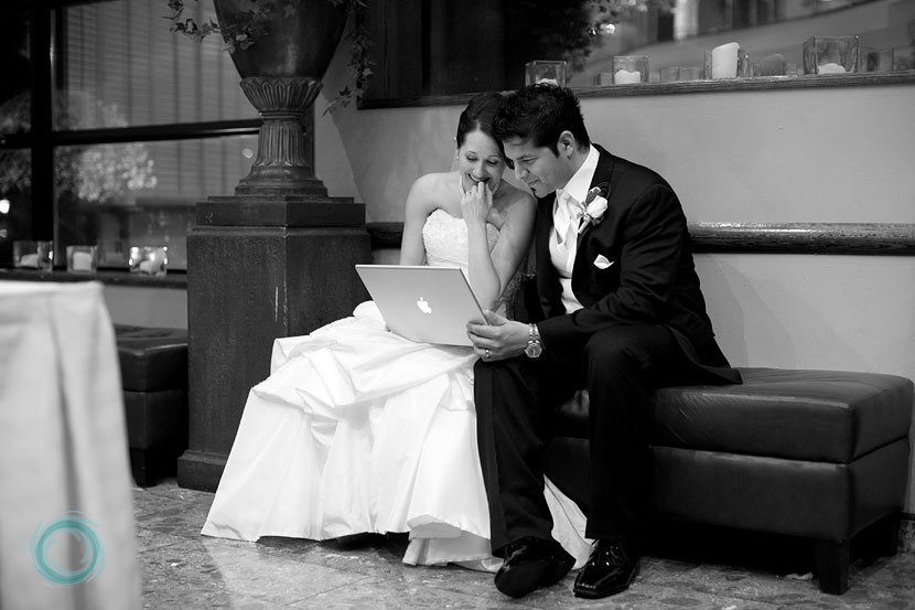 bride-and-groom-watching-their-same-day-wedding-slideshow-02