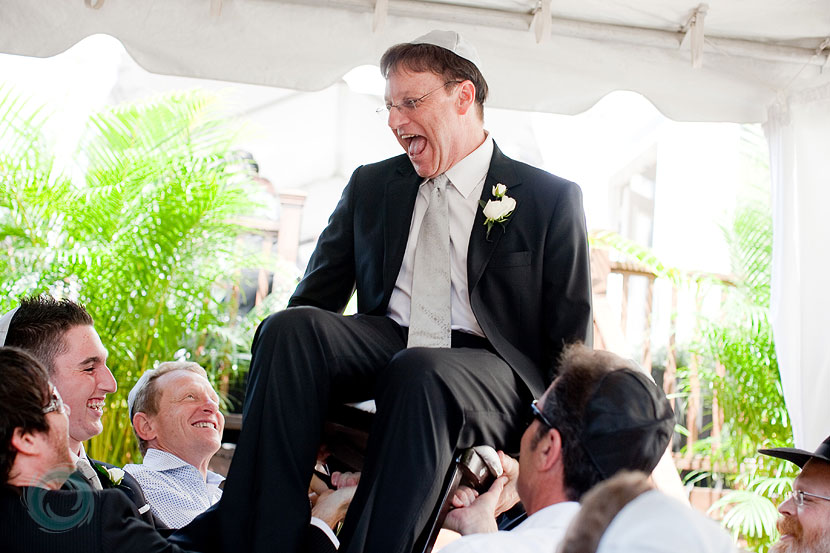 11-the groom having a laugh atop the chair