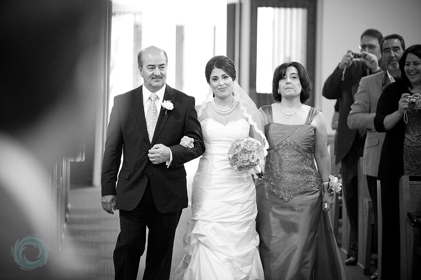 11-the groom looks on as his bride walks down the aisle