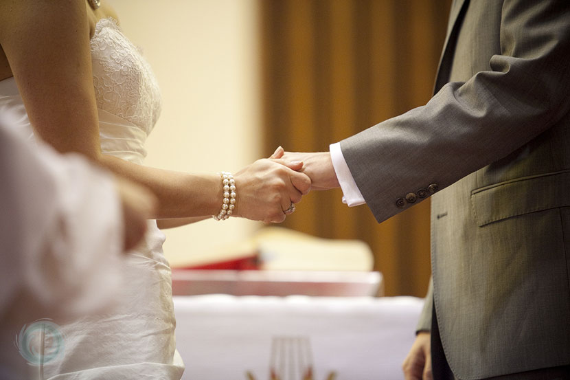 12-a small loving gesture as the rings are exchanged